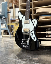 Close-up of black Riverton demo guitar with Bearcat humbuckers and Bigsby