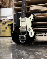 Close-up of black Veritas Portlander guitar with Bearcat humbuckers and Bigsby